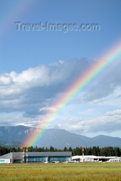 slovenia623: Slovenia - Brnik Airport: rainbow and hangar - Ljubljana Joze Pucnik Airport - Letalisce Jozeta Pucnika - photo by I.Middleton - (c) Travel-Images.com - Stock Photography agency - Image Bank