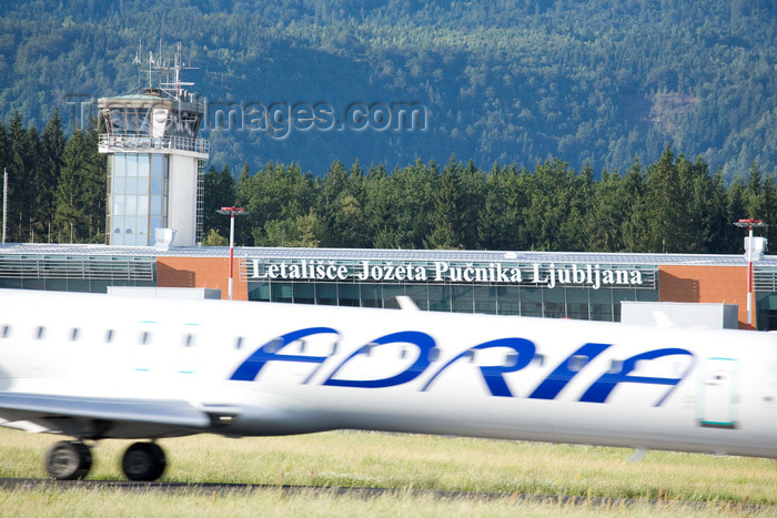 slovenia625: Slovenia - Brnik Airport: fuselage of Adria airplane and Terminal T1 of Ljubljana Joze Pucnik Airport - Adria is Slovenia's flag carrier - photo by I.Middleton - (c) Travel-Images.com - Stock Photography agency - Image Bank