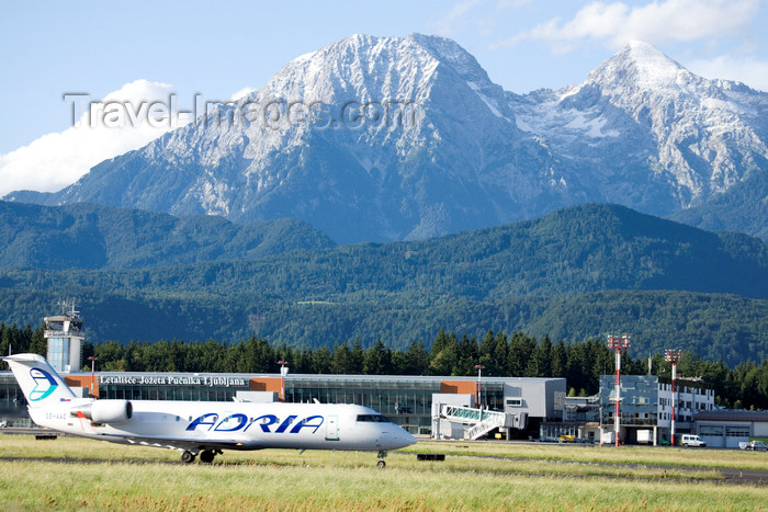 slovenia628: Slovenia - Brnik Airport: _MG_9077 - Adria airplane preparing to take off from Ljubljana Joze Pucnik international airport - Adria Airlines Canadair CRJ-200LR S5-AAE - photo by I.Middleton - (c) Travel-Images.com - Stock Photography agency - Image Bank