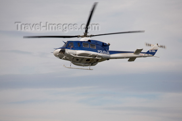 slovenia638: Slovenia - Brnik Airport: Slovenian Police Agusta Bell AB.412 S5-HPA helicopter patrolling Ljubljana Joze Pucnik Airport - photo by I.Middleton - (c) Travel-Images.com - Stock Photography agency - Image Bank
