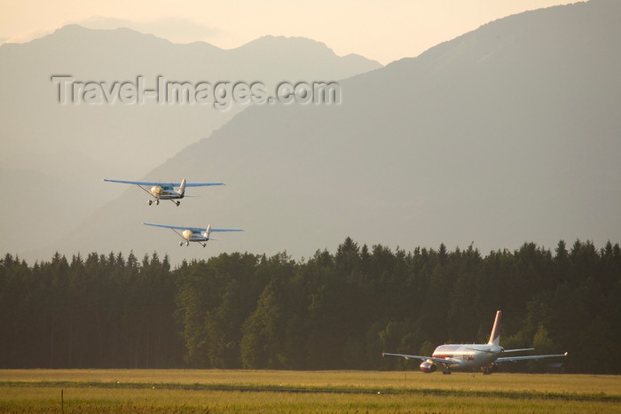 slovenia644: Slovenia - Brnik Airport: 2 Cessna 172 Skyhawk light aircraft and an Airbus A320 taking off from Ljubljana Joze Pucnik Airport - photo by I.Middleton - (c) Travel-Images.com - Stock Photography agency - Image Bank