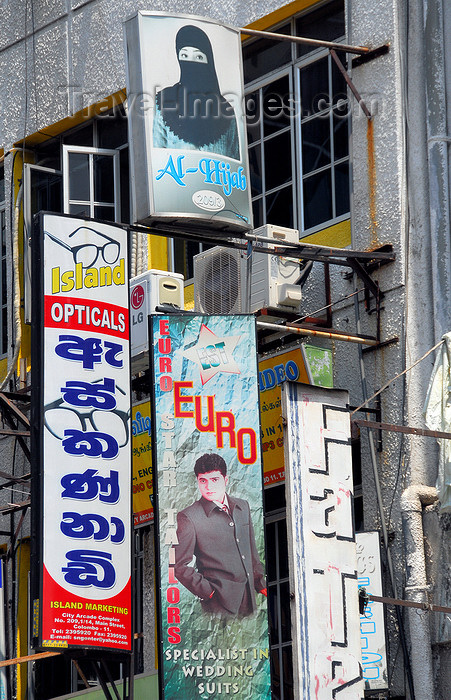 sri-lanka145: Colombo, Sri Lanka: European and Wahhabi fashion coexist - shop signs on Main st. - Pettah - photo by M.Torres - (c) Travel-Images.com - Stock Photography agency - Image Bank