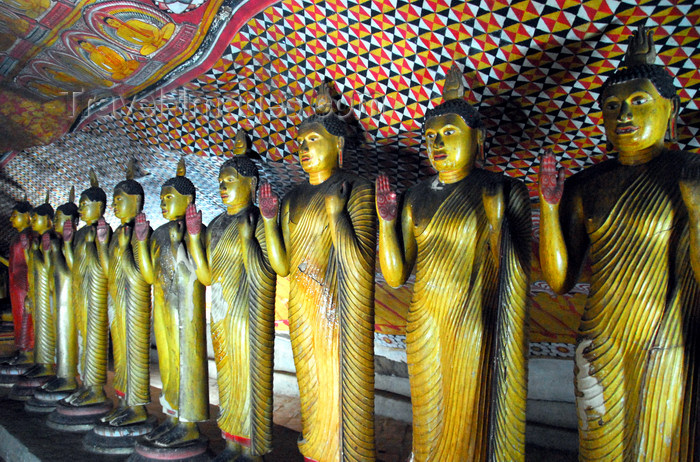 sri-lanka296: Dambulla, Central Province, Sri Lanka: line of Buddhas greeting the visitor - Maha Alut Vihara cave - Dambulla cave temple - UNESCO World Heritage Site - photo by M.Torres - (c) Travel-Images.com - Stock Photography agency - Image Bank