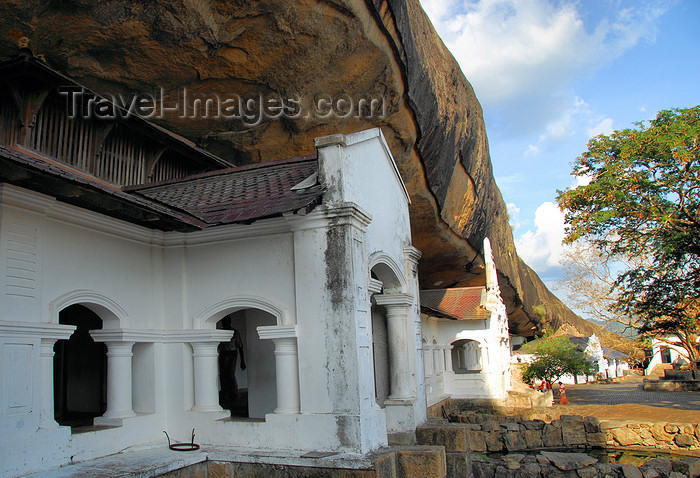 sri-lanka298: Dambulla, Central Province, Sri Lanka: arched colonnade under a overhanging rock slab - Dambulla cave temple - UNESCO World Heritage Site - photo by M.Torres - (c) Travel-Images.com - Stock Photography agency - Image Bank