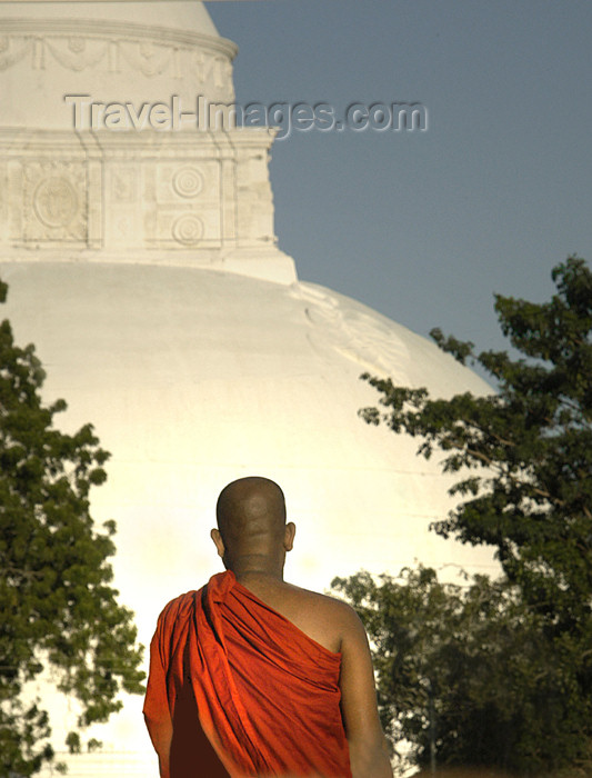 sri-lanka89: near Yala National Park / Ruhuna, Southern Province, Sri Lanka: Buddhist monk with dagoba in background - stupa - photo by B.Cain - (c) Travel-Images.com - Stock Photography agency - Image Bank