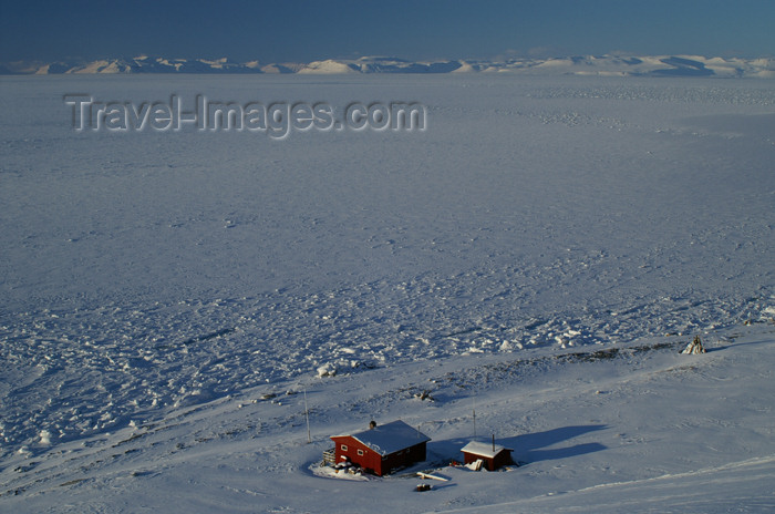 svalbard42: Svalbard - Spitsbergen island - Björndalen: view over a red hut and Isfjorden - photo by A.Ferrari - (c) Travel-Images.com - Stock Photography agency - Image Bank