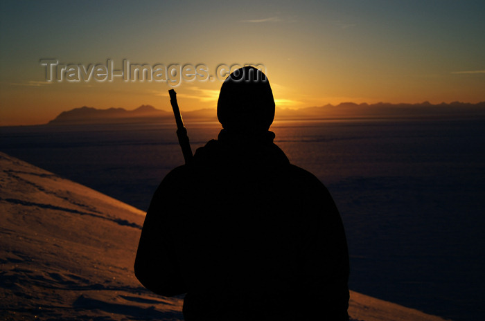 svalbard47: Svalbard - Spitsbergen island - Isfjorden: watching sunset with a rifle - photo by A.Ferrari - (c) Travel-Images.com - Stock Photography agency - Image Bank