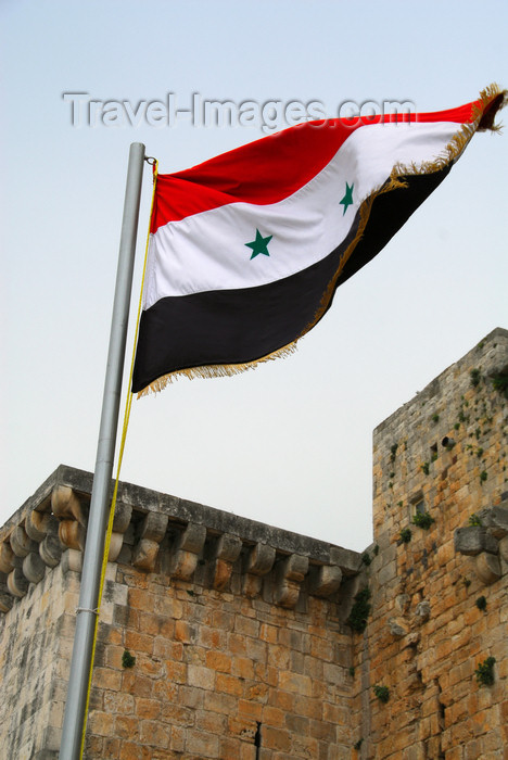 syria197: Crac des Chevaliers / Hisn al-Akrad, Al Hosn, Homs Governorate, Syria: Syrian flag at the castle's entrance - UNESCO World Heritage Site - photo by M.Torres /Travel-Images.com - (c) Travel-Images.com - Stock Photography agency - Image Bank