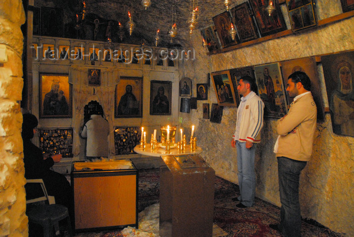 syria282: Maaloula - Rif Dimashq governorate, Syria:  Mar Taqla - praying at the Saint's chapel - shrine in a cave - photo by M.Torres / Travel-Images.com - (c) Travel-Images.com - Stock Photography agency - Image Bank