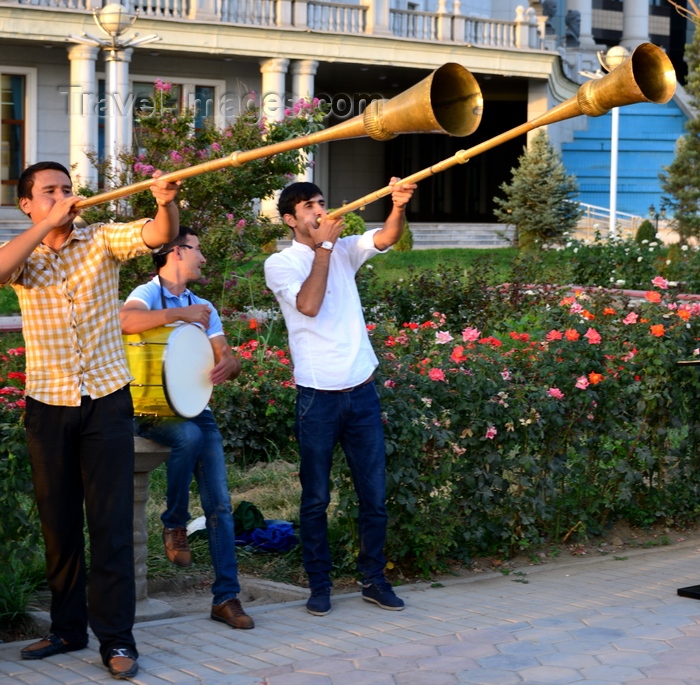 tajikistan42: Dushanbe, Tajikistan: muscians outside the National Library, Dusti square - karnay long trumpet, the national instrument - photo by M.Torres - (c) Travel-Images.com - Stock Photography agency - Image Bank