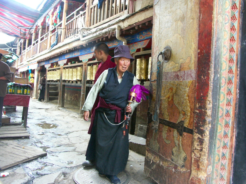 tibet31: Tibet - Lhasa: temple gate and prayer wheels - photo by P.Artus - (c) Travel-Images.com - Stock Photography agency - Image Bank