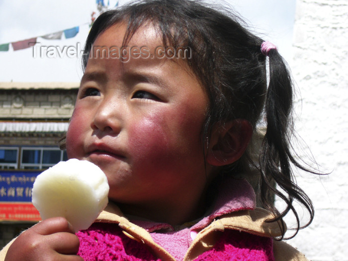 tibet44: Tibet - Lhasa: girl with sweet - photo by M.Samper - (c) Travel-Images.com - Stock Photography agency - Image Bank