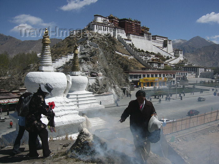 tibet57: Tibet - Lhasa: Potala palace, stupas, pilgrimns and ritual fire - photo by M.Samper - (c) Travel-Images.com - Stock Photography agency - Image Bank