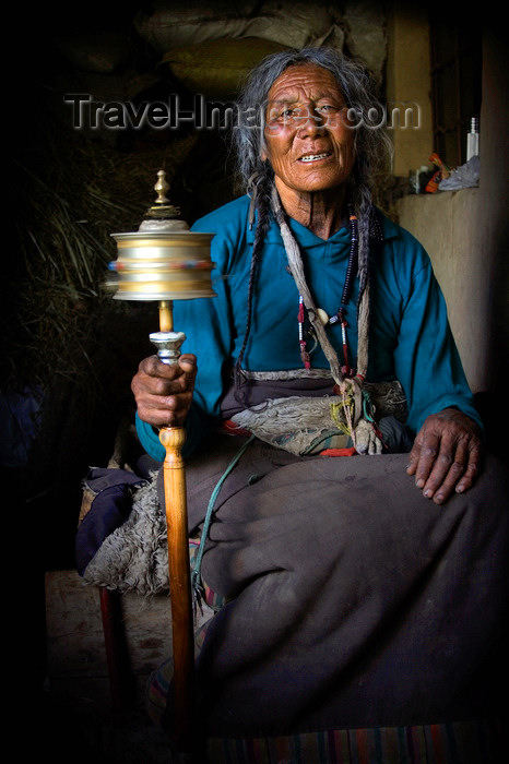 tibet96: Tibet - Pilgrim spinning prayer wheel - photo by Y.Xu - (c) Travel-Images.com - Stock Photography agency - Image Bank