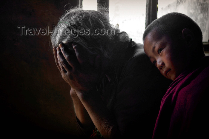 tibet98: Tibet - pilgrims worshipping - woman and boy - photo by Y.Xu - (c) Travel-Images.com - Stock Photography agency - Image Bank