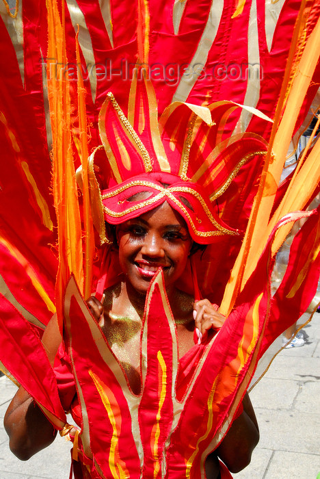trinidad-tobago110: Port of Spain, Trinidad and Tobago: girl with flaming red costume during the carnival parade - photo by E.Petitalot - (c) Travel-Images.com - Stock Photography agency - Image Bank