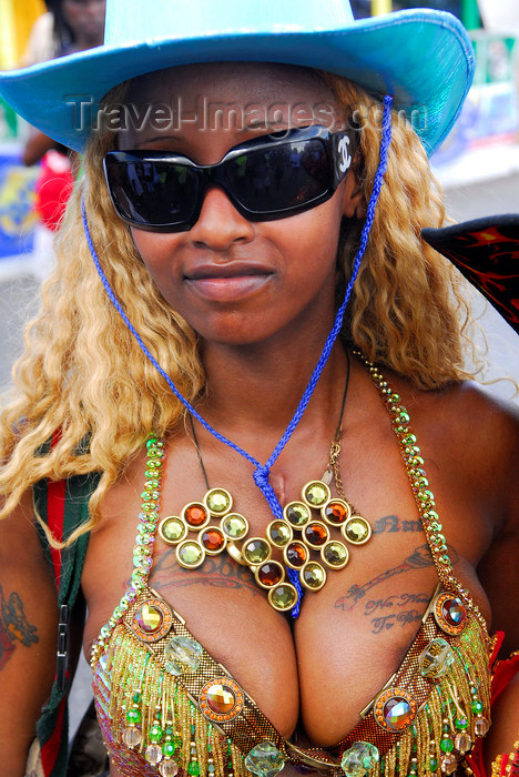  with tattoos on the breasts and wearing a blue hat - carnival - photo by 