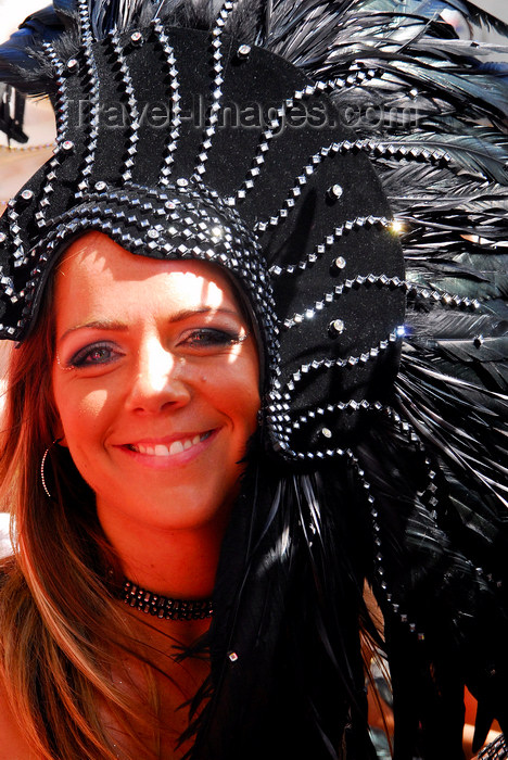 trinidad-tobago154: Port of Spain, Trinidad and Tobago: smiling white girl with black feathers on the head during carnival - photo by E.Petitalot - (c) Travel-Images.com - Stock Photography agency - Image Bank