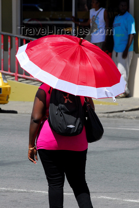 trinidad-tobago36: Scarborough, Tobago: woman seeking protection from the sun - parasol - photo by E.Petitalot - (c) Travel-Images.com - Stock Photography agency - Image Bank