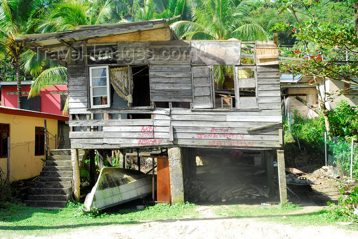 trinidad-tobago45: Maracas Bay, Tobago: house destroyed by a tornado - building on stilts - waterfront - photo by E.Petitalot - (c) Travel-Images.com - Stock Photography agency - Image Bank