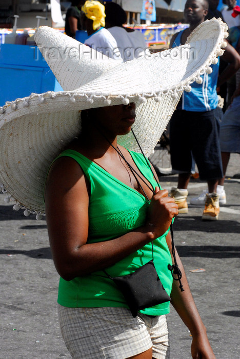 trinidad-tobago48: Port of Spain, Trinidad: woman wearing an immense sombrero hat for sun protection - photo by E.Petitalot - (c) Travel-Images.com - Stock Photography agency - Image Bank