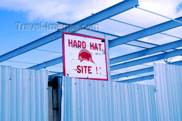 trinidad-tobago57: Port of Spain, Trinidad: hard hat sign, fence and steel beams at a construction site - construction safety  - photo by E.Petitalot - (c) Travel-Images.com - Stock Photography agency - Image Bank