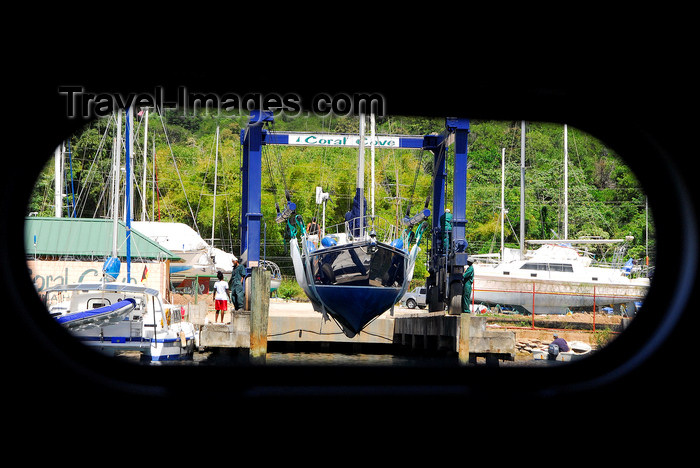 trinidad-tobago71: Port of Spain, Trinidad: taking a boat out of the water for repairs - mobile hoist - porthole view - photo by E.Petitalot - (c) Travel-Images.com - Stock Photography agency - Image Bank