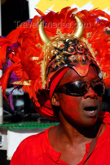 trinidad-tobago73: Port of Spain, Trinidad and Tobago: a man with devil head like a cap during carnival - African influence - mythology - photo by E.Petitalot - (c) Travel-Images.com - Stock Photography agency - Image Bank