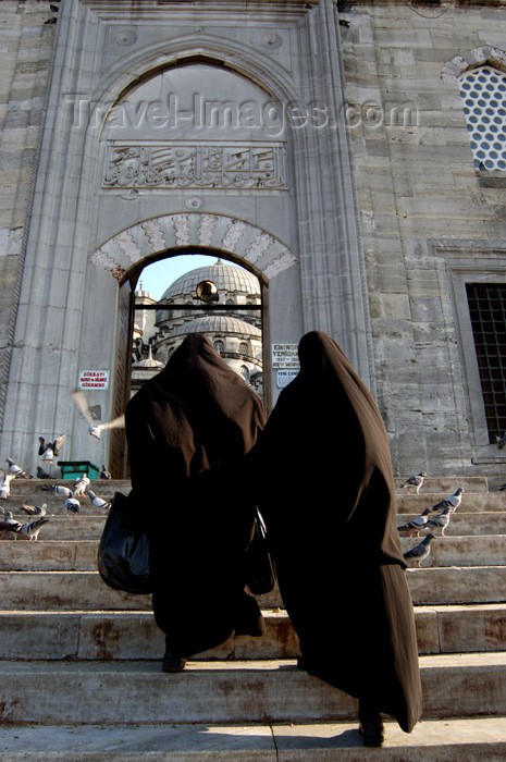 turkey191: Istanbul, Turkey: muslim women entering the New mosque / yeni camii - photo by J.Wreford - (c) Travel-Images.com - Stock Photography agency - Image Bank