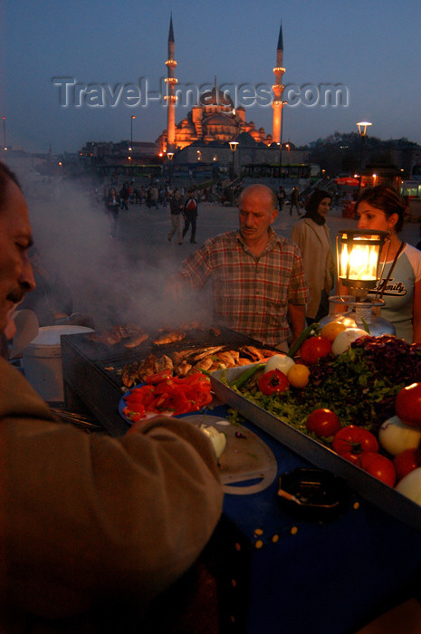 turkey215: Istanbul, Turkey: grilled fish and New Mosque / yeni camii at night - photo by J.Wreford - (c) Travel-Images.com - Stock Photography agency - Image Bank