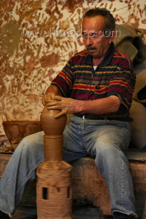 turkey369: Turkey - Cappadocia - Avanos: a potter at work - pottery - photo by C.Roux - (c) Travel-Images.com - Stock Photography agency - Image Bank