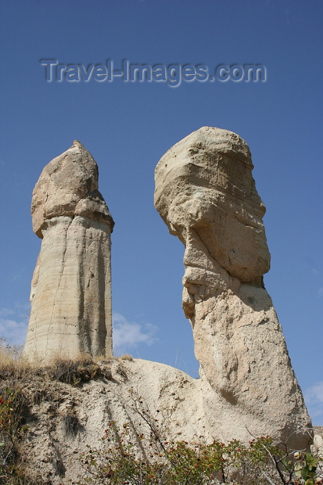 turkey375: Turkey - Cappadocia - Valley of Love: twin fairy chimneys - basalt on sandstone - photo by C.Roux - (c) Travel-Images.com - Stock Photography agency - Image Bank