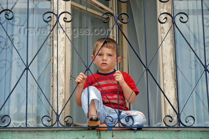 turkey527: Yusufeli, Artvin Province, Black Sea region, Turkey: boy in a balcony - photo by W.Allgöwer - (c) Travel-Images.com - Stock Photography agency - Image Bank