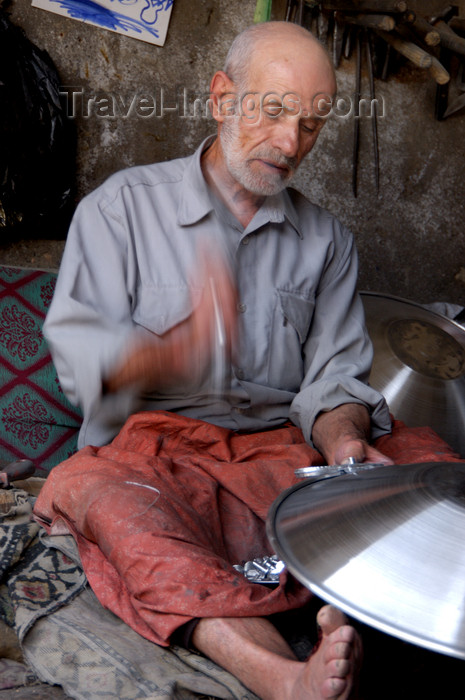 turkey581: Mardin - Southeastern Anatolia, Turkey: artisan making a large metal plate - photo by J.Wreford - (c) Travel-Images.com - Stock Photography agency - Image Bank