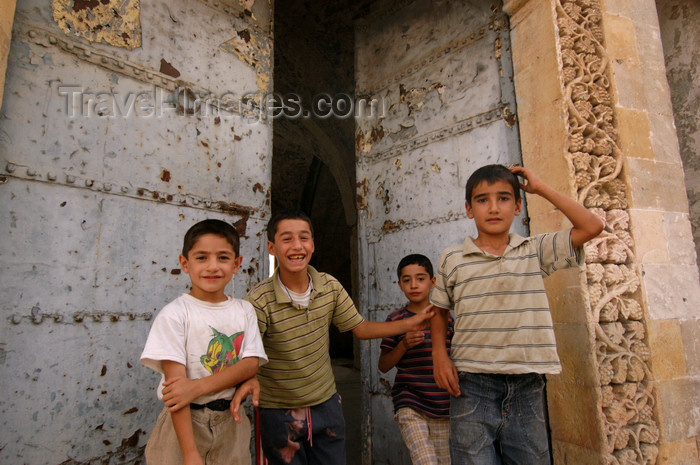 turkey582: Mardin - Southeastern Anatolia, Turkey: children and large gate - photo by J.Wreford - (c) Travel-Images.com - Stock Photography agency - Image Bank