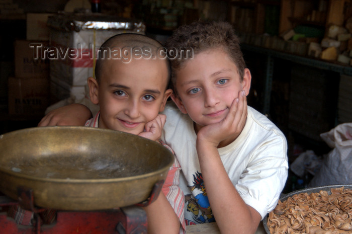 turkey583: Mardin - Southeastern Anatolia, Turkey: buddies - kids in a store - day dreamer deep in his thoughts - photo by J.Wreford - (c) Travel-Images.com - Stock Photography agency - Image Bank