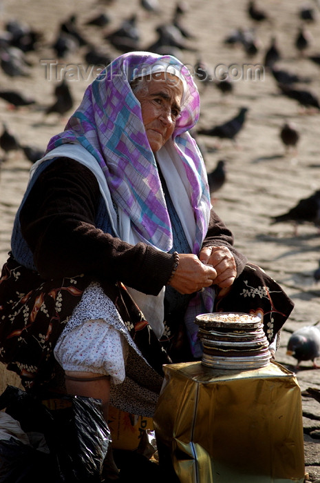 turkey8: Istanbul, Turkey: old woman selling bird feed outside Istanbul university - Beyazit square - photo by J.Wreford - (c) Travel-Images.com - Stock Photography agency - Image Bank