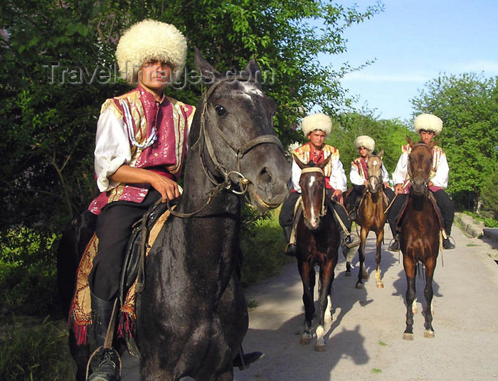 turkmenistan114: Ashgabat - Turkmenistan - yougn men in Akhalteke / Ahalteke breed horses - national Turkmen clothes - photo by G.Karamyanc / Travel-Images.com - (c) Travel-Images.com - Stock Photography agency - Image Bank