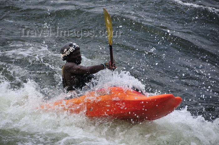 uganda154: Bujagali Falls, Jinja district, Uganda: kayaker struggles with turbolent water on the falls, a combination of catarats and rapids on the river Nile - seen from the Eastern bank - in 2012 the falls were submerged by the Bujagali Dam - photo by M.Torres - (c) Travel-Images.com - Stock Photography agency - Image Bank