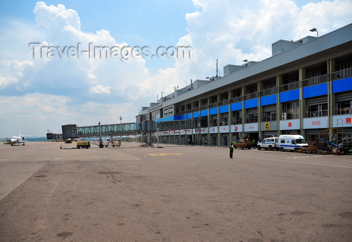 uganda16: Entebbe, Wakiso District, Uganda: Entebbe International Airport - terminal building with empty air-bridge and executive jet on the apron - photo by M.Torres - (c) Travel-Images.com - Stock Photography agency - Image Bank