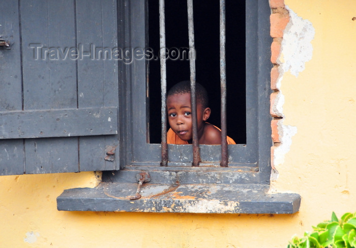 uganda188: Entebbe, Wakiso District, Uganda: curious boy at the window of his house - steel bars - photo by M.Torres - (c) Travel-Images.com - Stock Photography agency - Image Bank