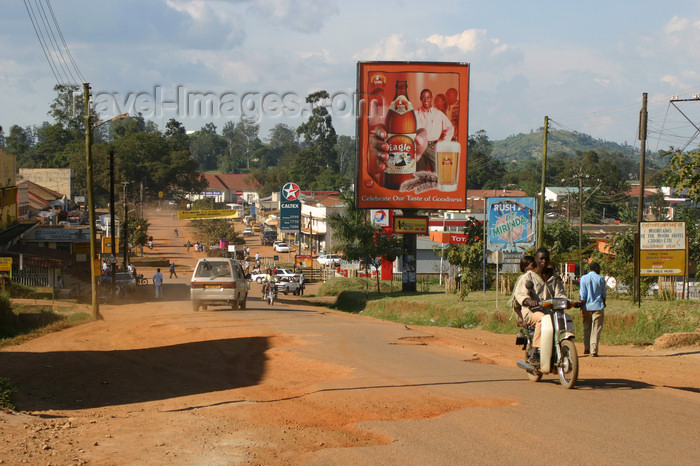 uganda55: Uganda - road scenery - beer billboard - photo by E.Andersen - (c) Travel-Images.com - Stock Photography agency - Image Bank