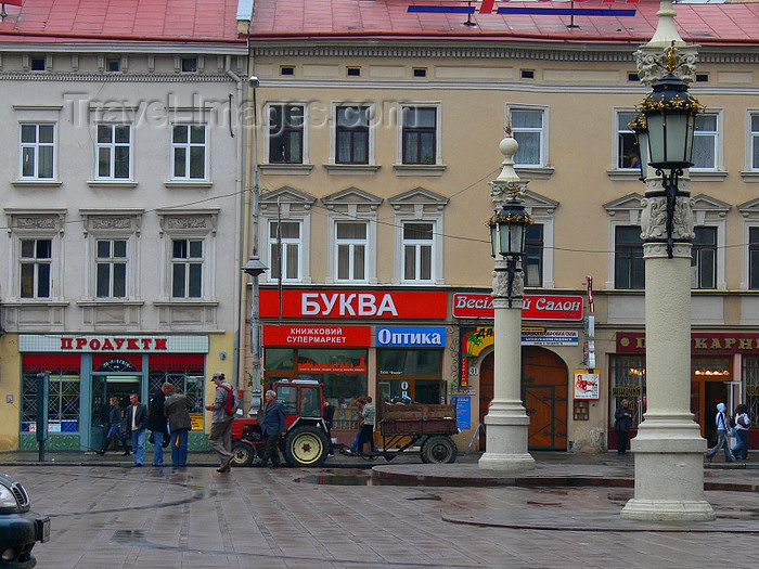 ukra83: Lviv / Lvov, Ukraine: shops and imposing lamps - city centre - UNESCO World Heritage Site - photo by J.Kaman - (c) Travel-Images.com - Stock Photography agency - Image Bank