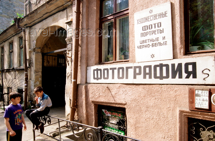 ukra99: Odessa, Ukraine: two boys in front of a photographer's shop - dilapidated building - photo by K.Gapys - (c) Travel-Images.com - Stock Photography agency - Image Bank