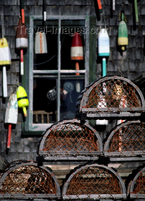 usa1093: Maine, USA: lobster traps and floats on fishing wharf - wooden house - photo by C.Lovell - (c) Travel-Images.com - Stock Photography agency - Image Bank
