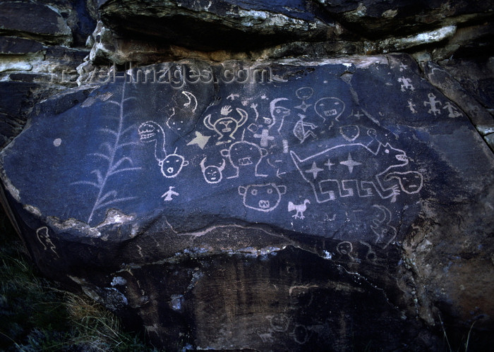 usa1616: Chama River Canyon, New Mexico, USA: ancient petroglyphs verify the Anasazi's presence in the area - faces, animals, plants and symbols - Georgia O'Keefe Country - photo by C.Lovell - (c) Travel-Images.com - Stock Photography agency - Image Bank