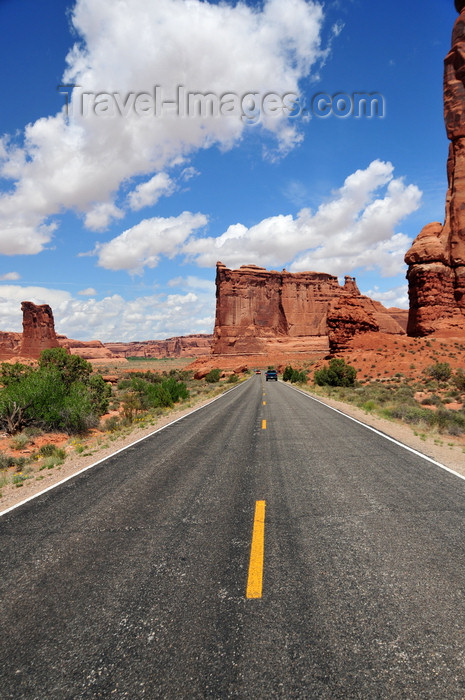 usa1669: Arches National Park, Utah, USA: Courthouse Towers - Tower of Babel and Sheep Rock seen from the road - asphalt and yellow line on Arches Entrance Road - photo by M.Torres - (c) Travel-Images.com - Stock Photography agency - Image Bank