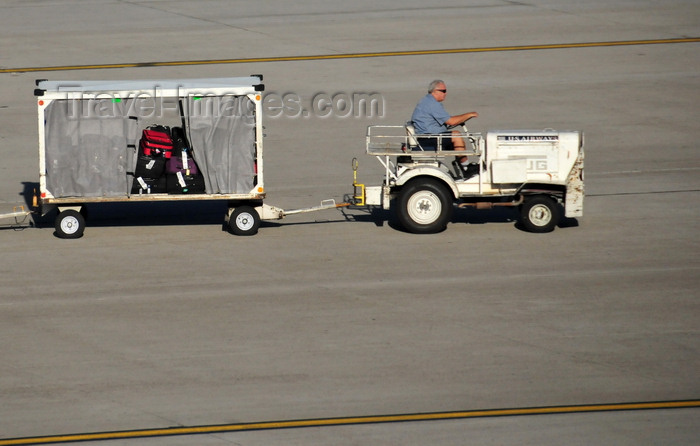 usa184: Phoenix, Arizona, USA: a tug moves baggage for US Airways - Sky Harbor International Airport - photo by M.Torres - (c) Travel-Images.com - Stock Photography agency - Image Bank