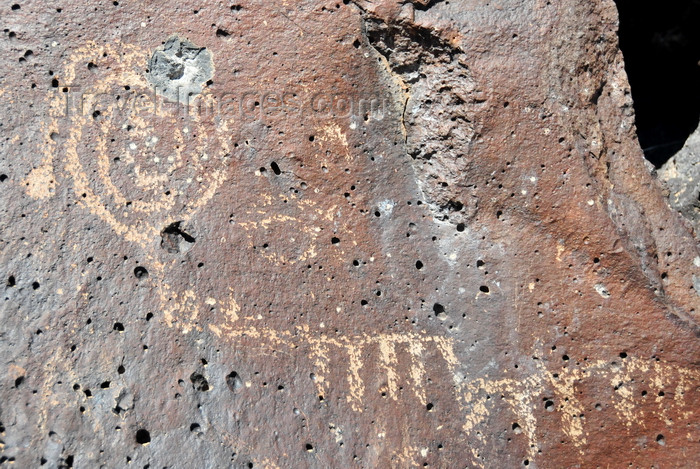 usa1980: Albuquerque, Bernalillo County, New Mexico, USA: Petroglyph National Monument - Rinconada Canyon trail - bullet-damaged spiral - petroglyph made by pecking the basalt - photo by M.Torres - (c) Travel-Images.com - Stock Photography agency - Image Bank