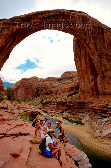 usa2216: Lake Powell, Utah, USA: People dwarfed by Rainbow Bridge National Monument - the largest natural bridge in the world - San Juan County - photo by C.Lovell - (c) Travel-Images.com - Stock Photography agency - Image Bank